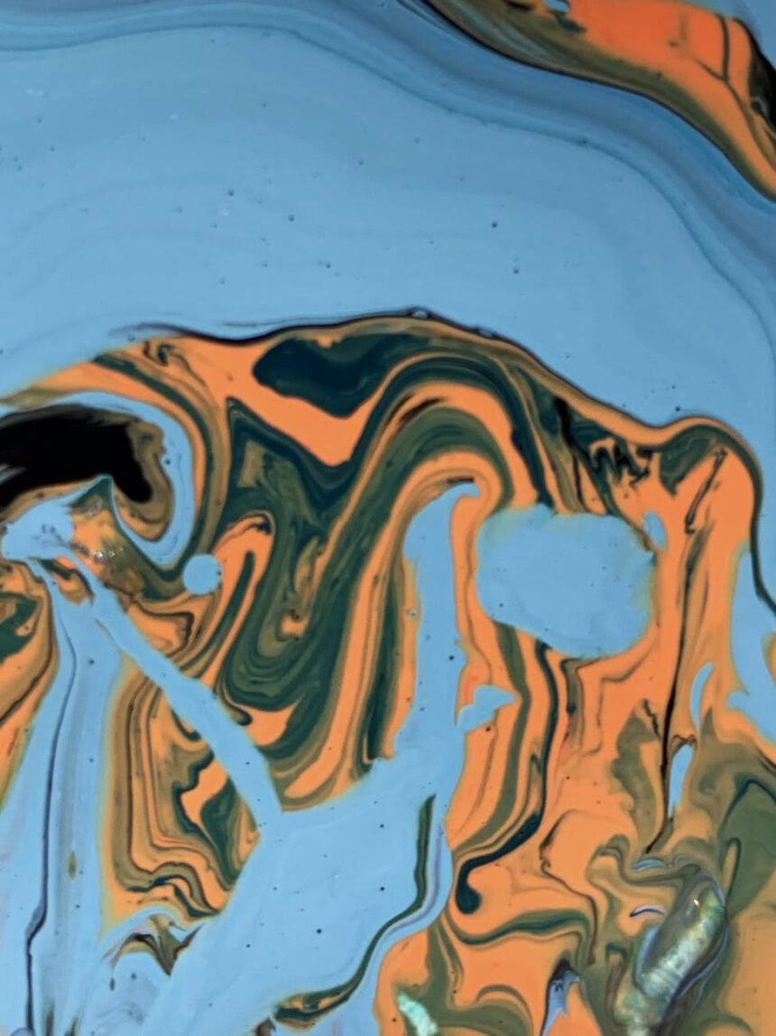 Abstract swirling colors representing the disorientation and emotional mix experienced during culture shock coping.