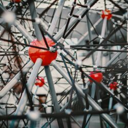 Abstract representation of interconnected glowing dots, symbolizing the importance of college community support for student success.