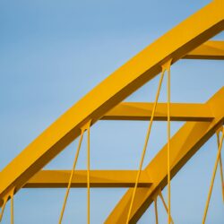 An abstract image of a bridge connecting two sides, representing the bridging of communication about money problems parents and children face.