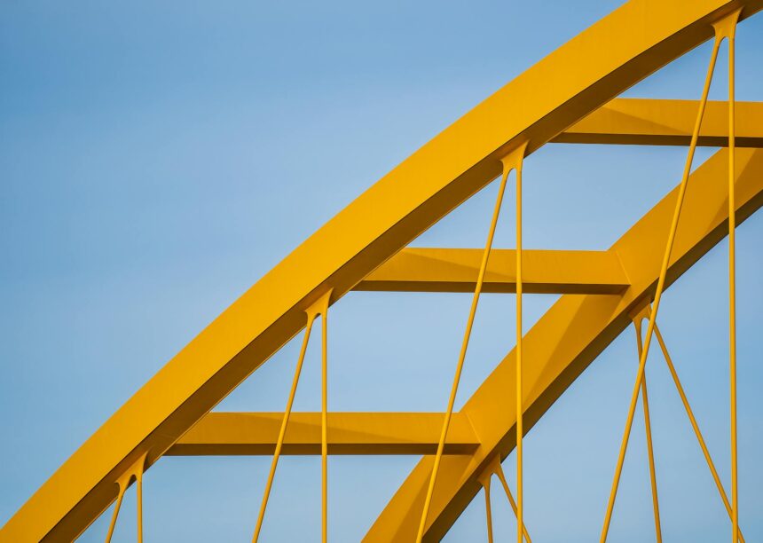 An abstract image of a bridge connecting two sides, representing the bridging of communication about money problems parents and children face.