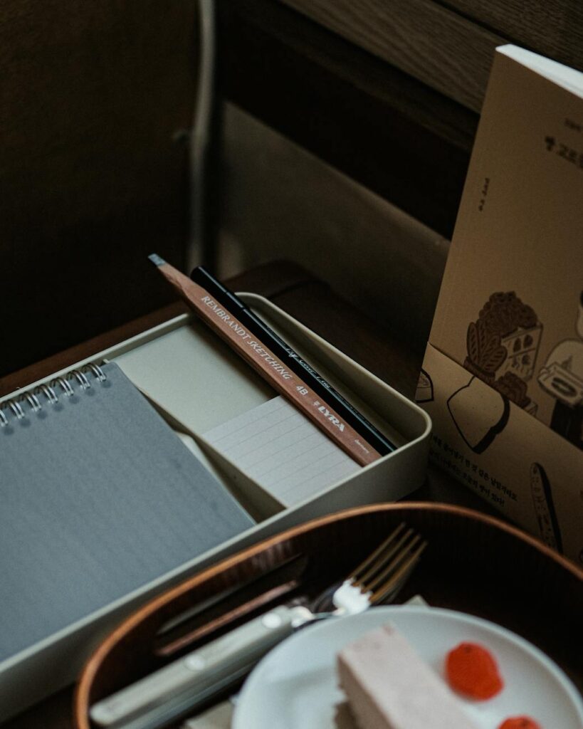 An overhead view of a well-organized study space featuring a planner, highlighters, a textbook, and a laptop, ready for a productive session.