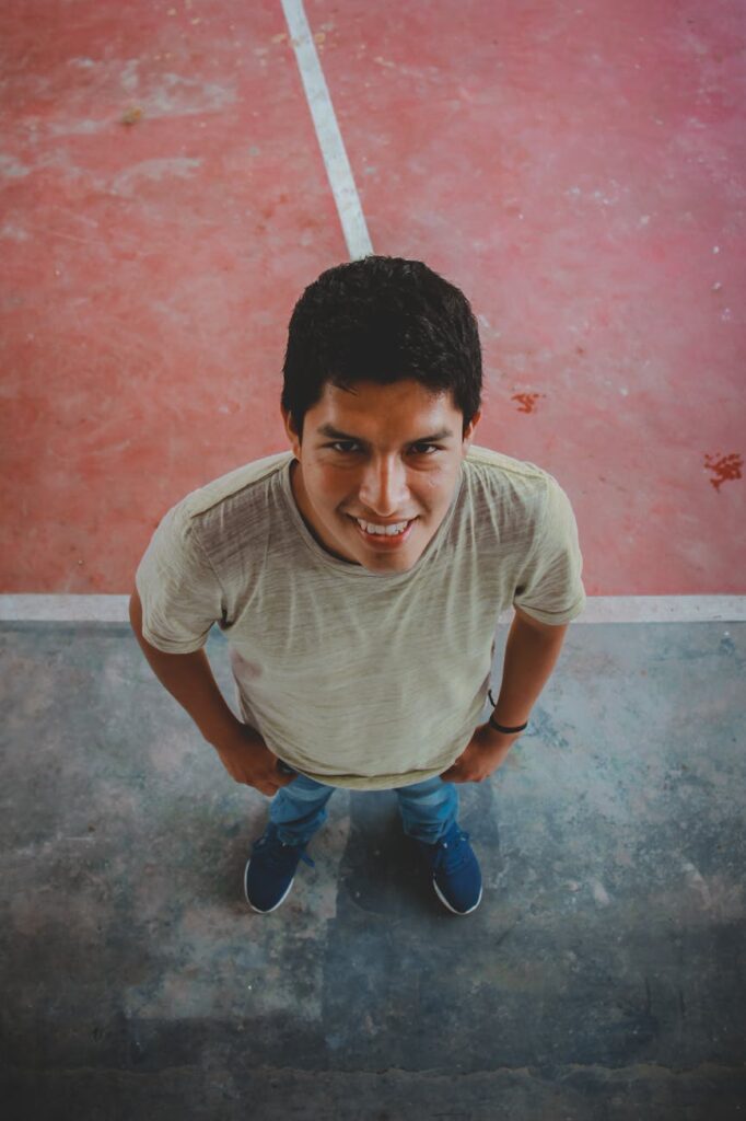 A happy young professional feeling in control of their finances, symbolizing successful student loan management.