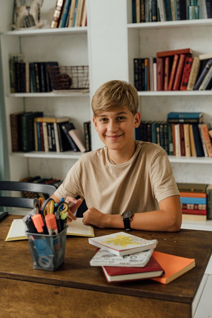 A student using a yellow highlighter to mark important passages in a textbook in a well-lit library setting.