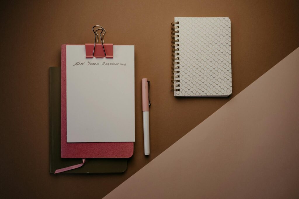 A close-up of a detailed weekly planner with subjects color-coded for exam revision.