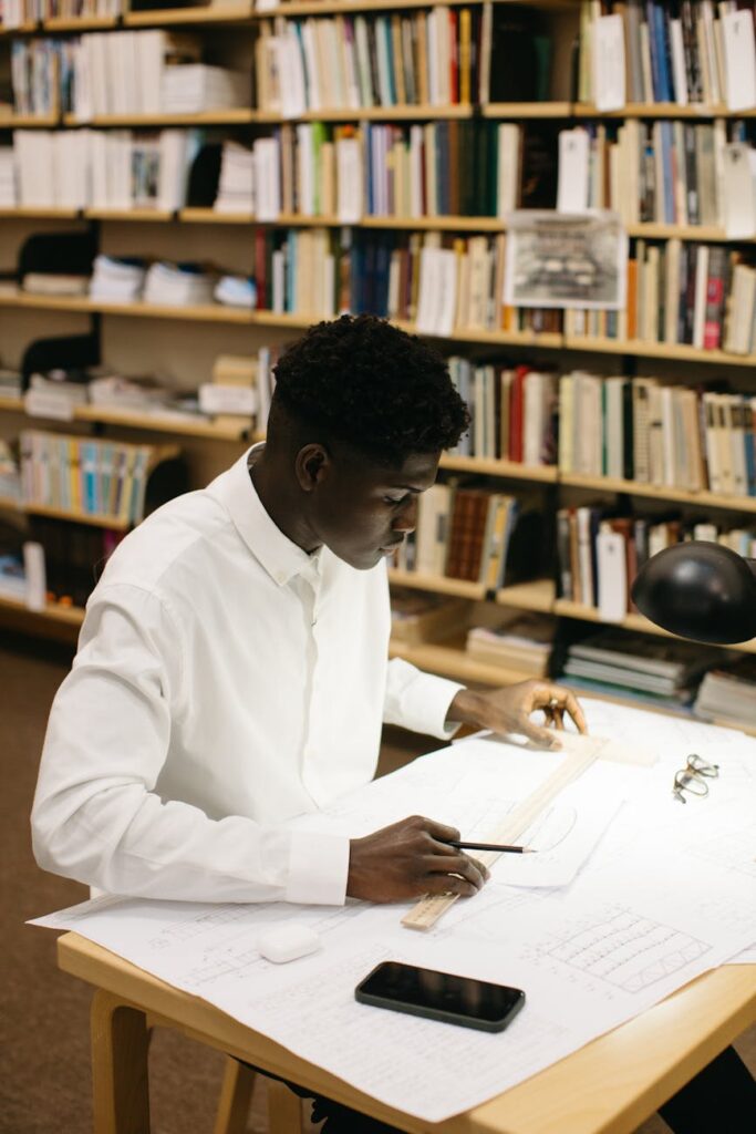 A close-up shot of a person's hands holding a complex academic text, demonstrating deep concentration.