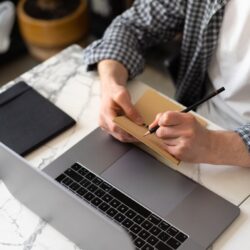 A student's desk covered with detailed sketchnotes, showing how visual notes can improve academic performance.