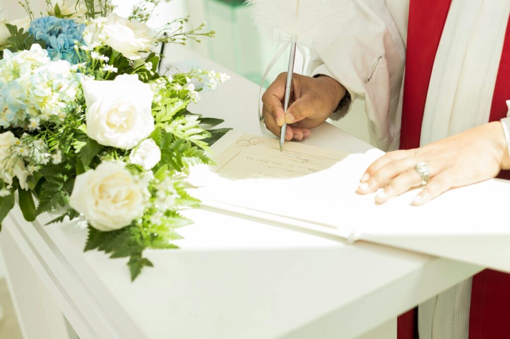 A close-up of a hand using a red pen to circle a mistake on a financial document, representing a credit report dispute.