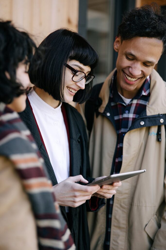 A diverse group of college students smiling and looking confidently towards the future, representing financial empowerment.